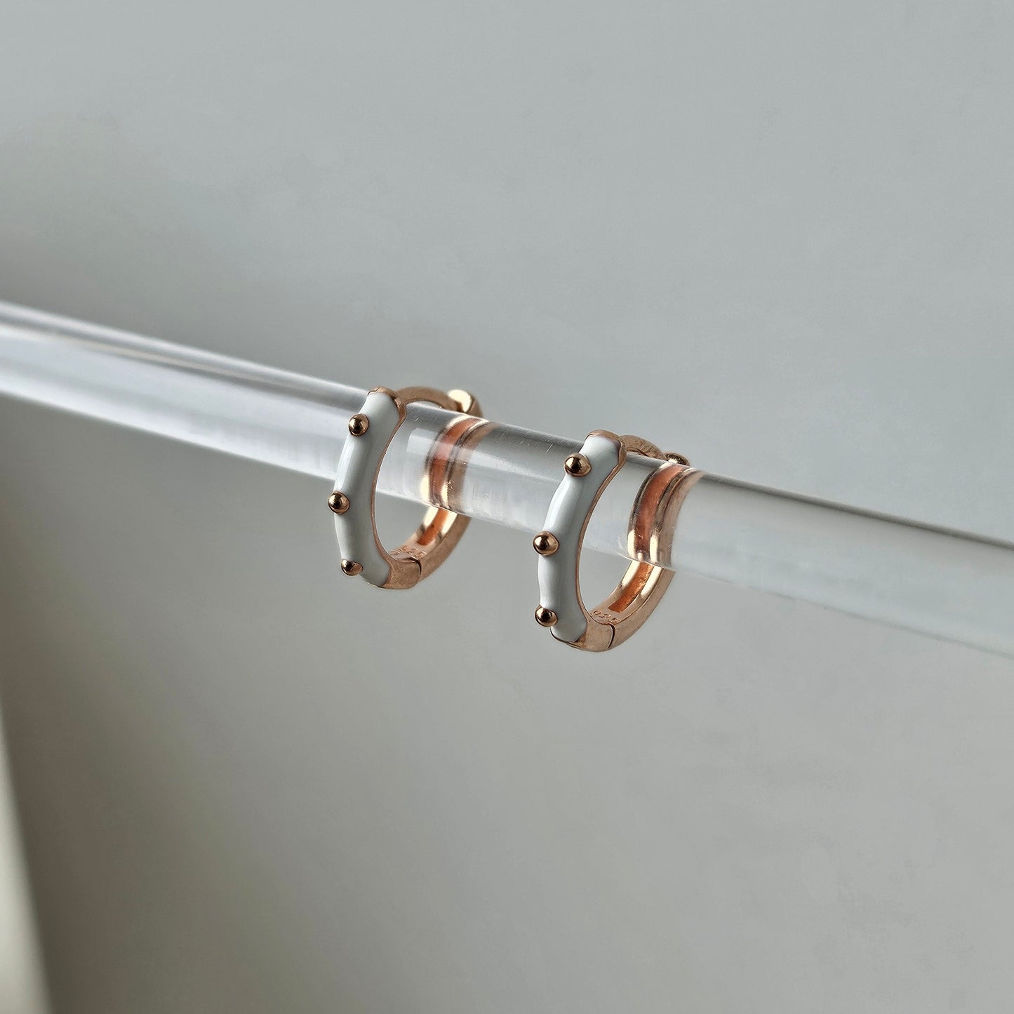 white enamel hoop with 3 dots of gold