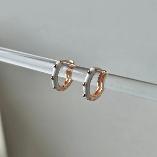 white enamel hoop with 3 dots of gold